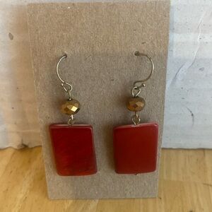 Dark pinkish red glass tile hanging earrings with copper colored bead. Vintage